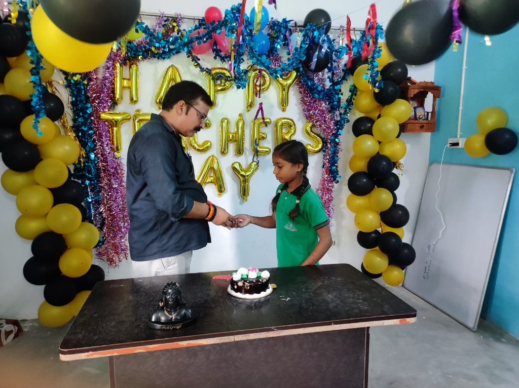 Founder and Student Sharing Cake Cutting on Teacher's Day
